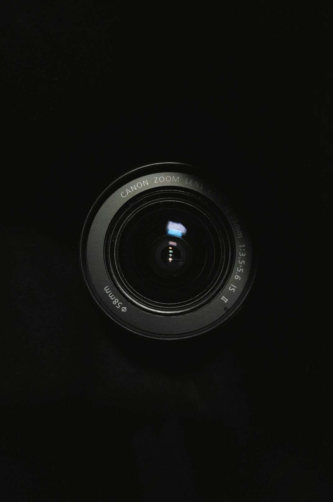 Close-up of a camera lens with reflections